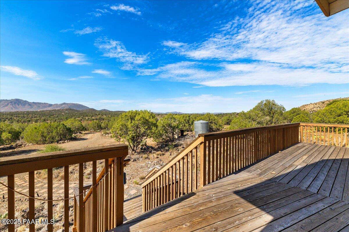 14195 Tapper Trail Prescott, AZ 86305 - Photo 3 of 46 a view of a balcony with wooden floor & fence