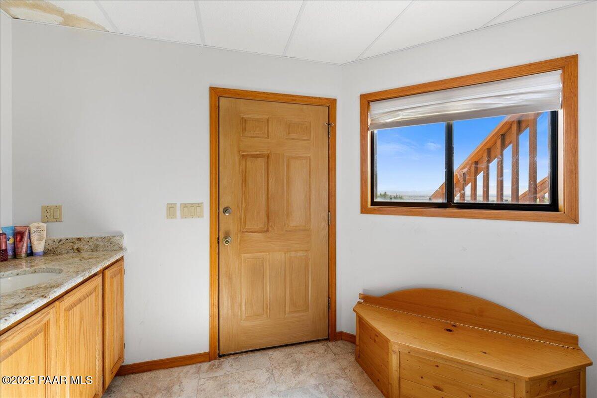 14195 Tapper Trail Prescott, AZ 86305 - Photo 36 of 46 a bathroom with a granite countertop sink and a mirror