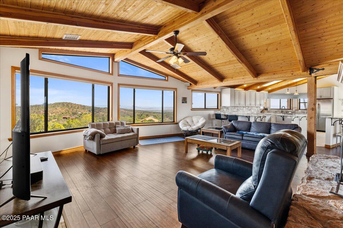 14195 Tapper Trail Prescott, AZ 86305 - Photo 7 of 46 a living room with furniture floor to ceiling window and wooden floor