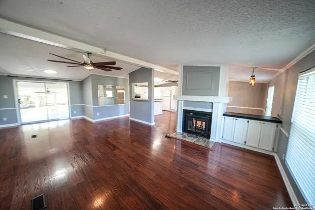 a view of a living room a fireplace with wooden floor