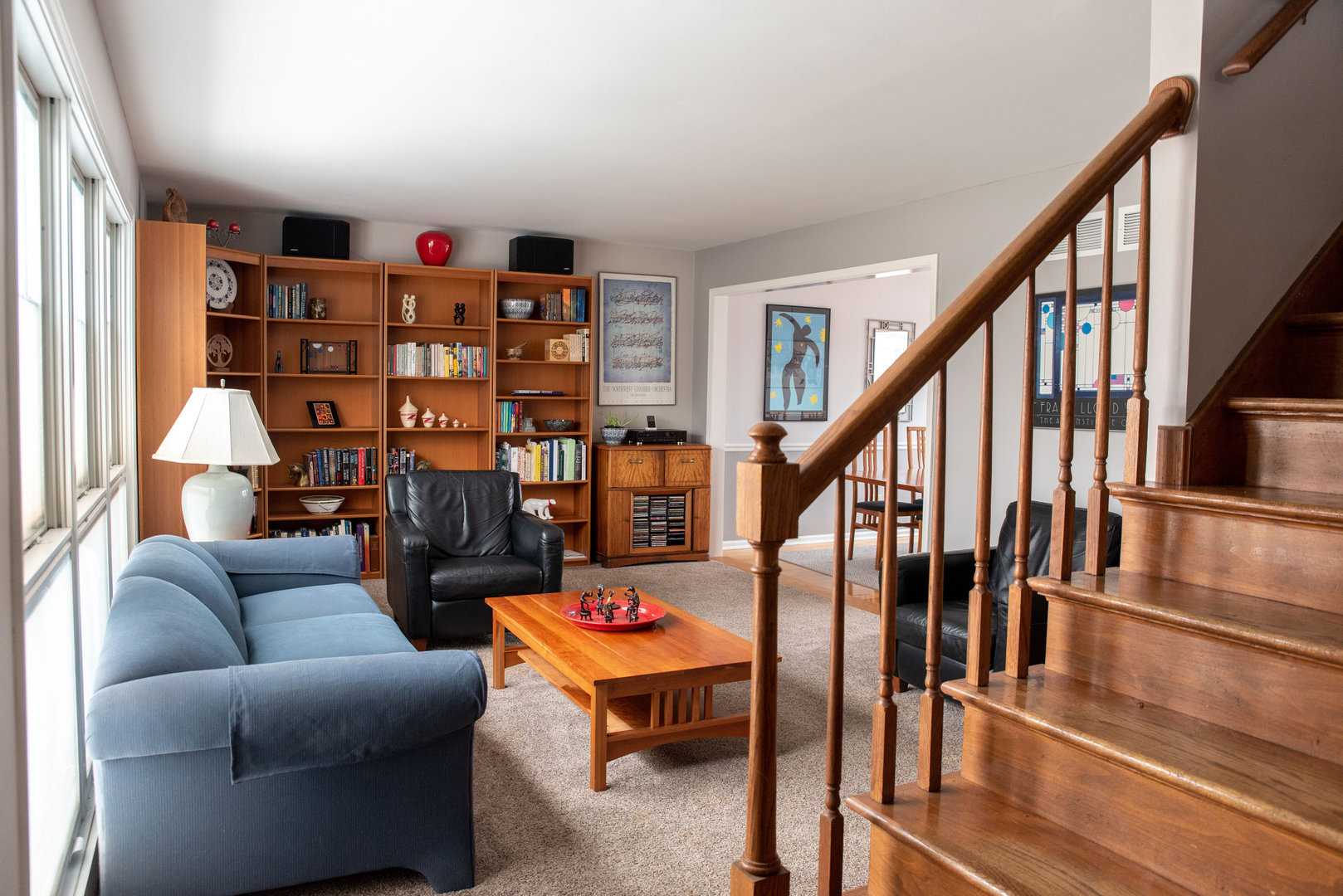 1410 Daly Road Wheaton, IL 60187 - Photo 2 of 34 a living room with lots of furniture and a book shelf