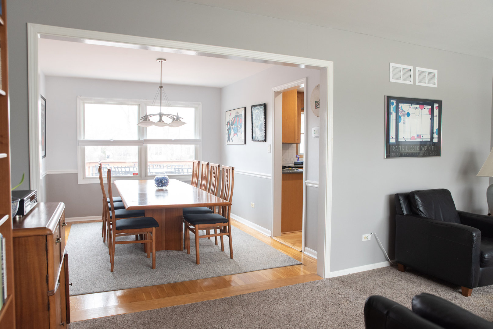 1410 Daly Road Wheaton, IL 60187 - Photo 15 of 34 a dining room with furniture a chandelier and wooden floor