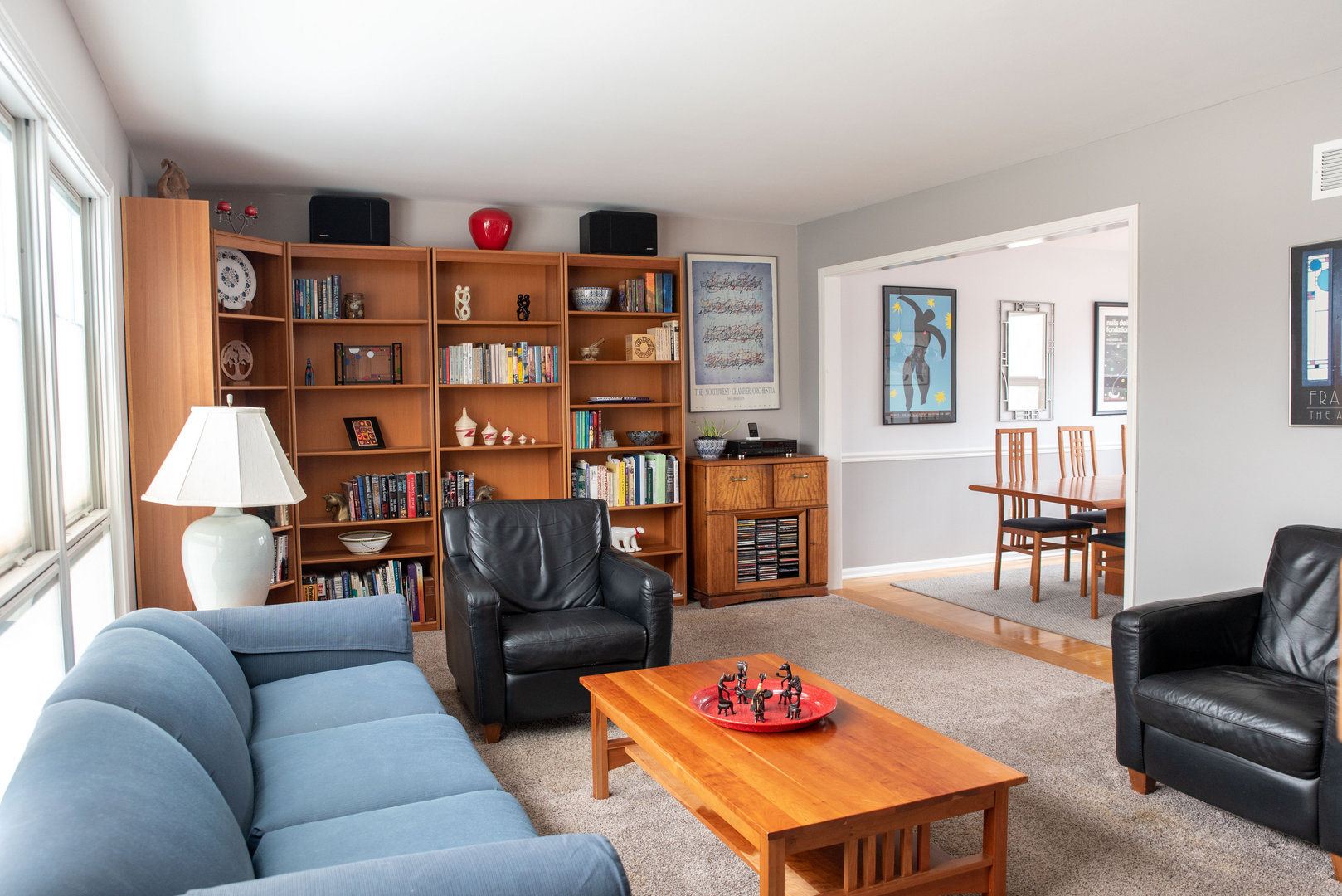 1410 Daly Road Wheaton, IL 60187 - Photo 3 of 34 a living room with furniture cabinets and a wooden floor