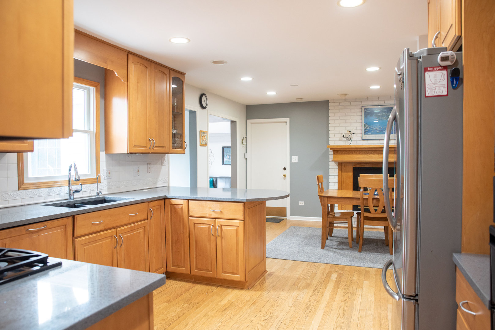 1410 Daly Road Wheaton, IL 60187 - Photo 6 of 34 a large kitchen with stainless steel appliances lots of counter space and breakfast area