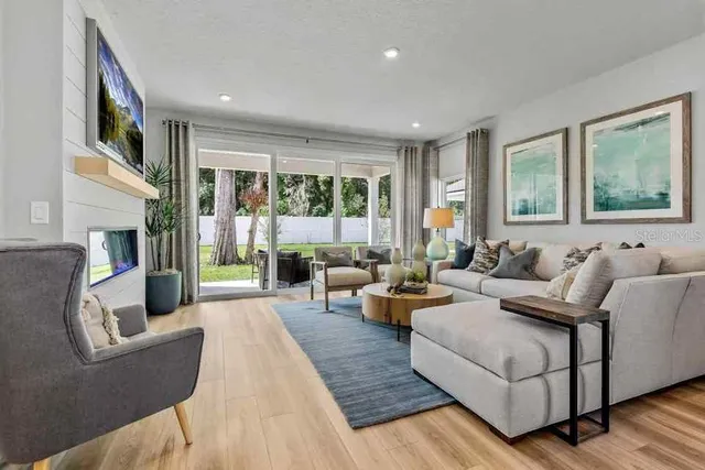 a spacious bedroom with a bed and a couch