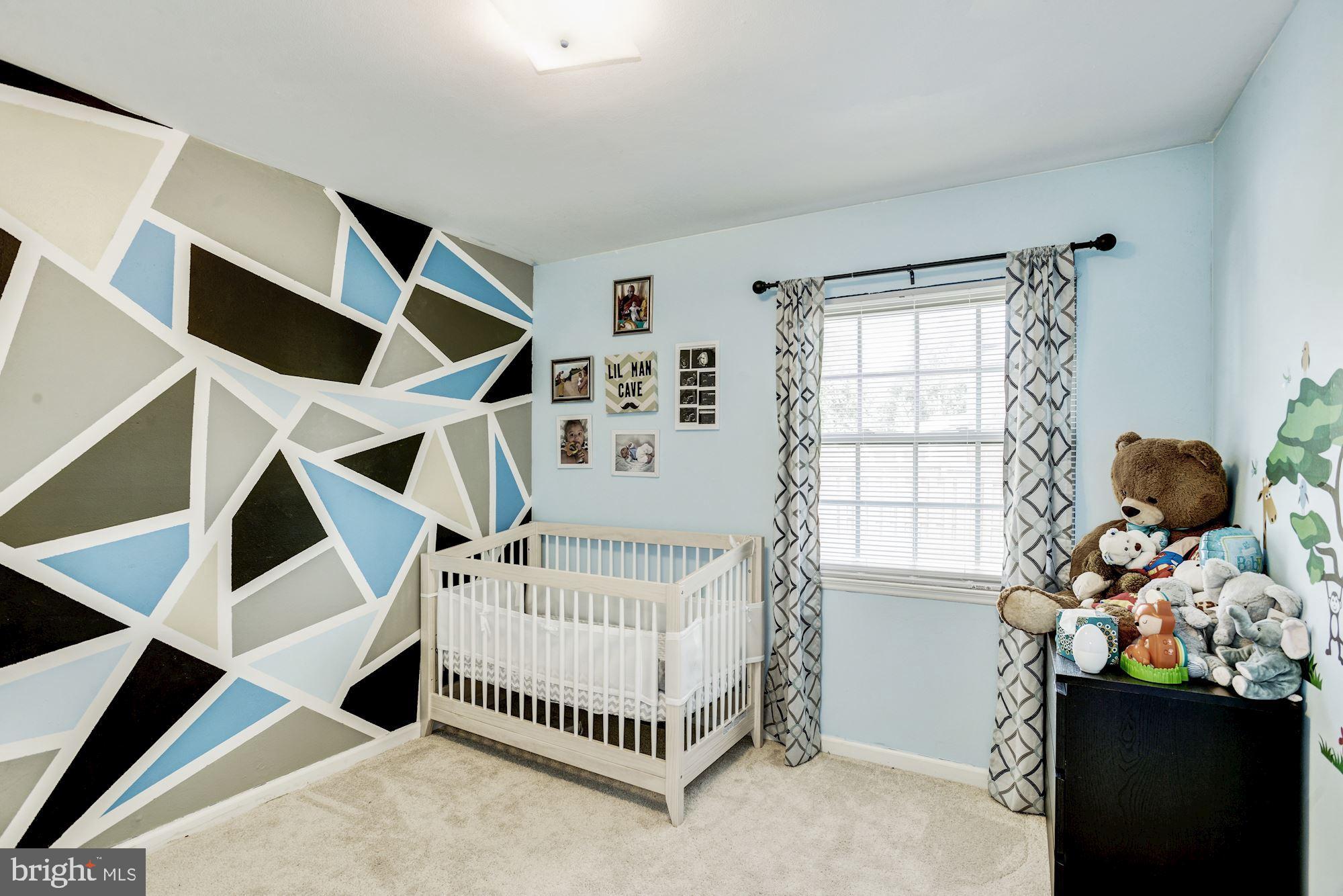 6708 Cimarron Street Springfield, VA 22150 - Photo 29 of 46 a bedroom with a bed and a window
