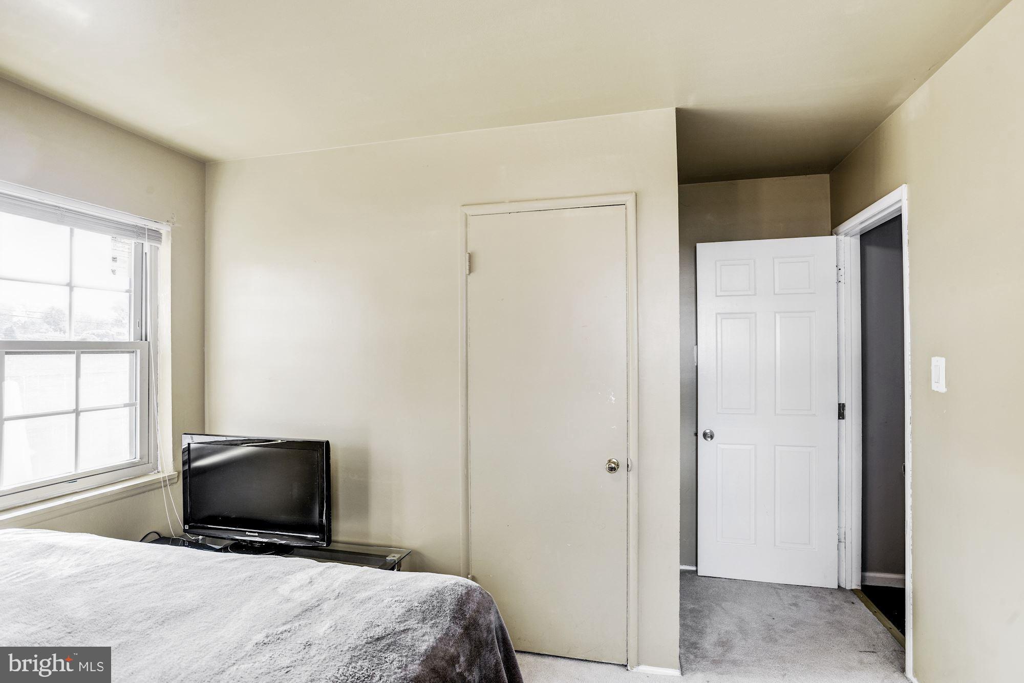 6708 Cimarron Street Springfield, VA 22150 - Photo 34 of 46 a bedroom with a bed and a television