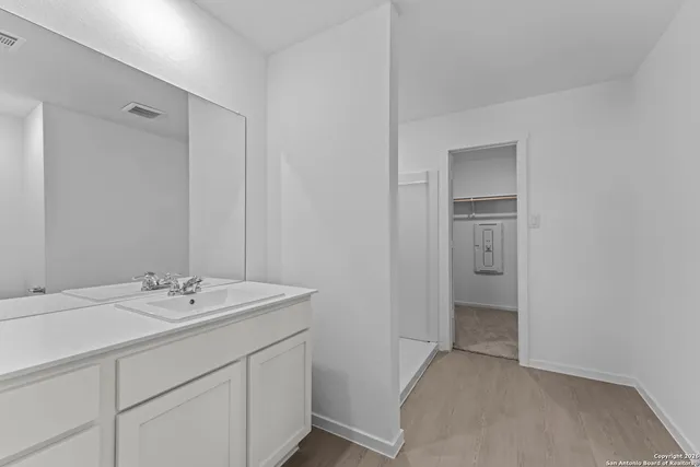 a bathroom with a shower and a toilet