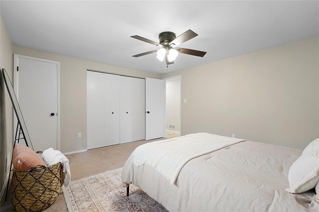 185 Grouse Drive Elizabeth, PA 15037 - Photo 21 of 45 a bedroom with a bed and a chandelier