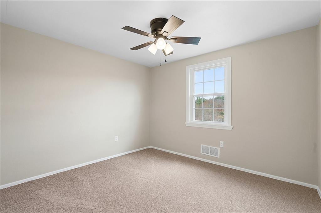 185 Grouse Drive Elizabeth, PA 15037 - Photo 26 of 45 an empty room with ceiling fan and window