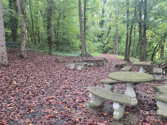 341 Hopewell Church Road Catawba, NC 28609 - Photo 8 of 11 a view of a backyard with table and chairs potted plants