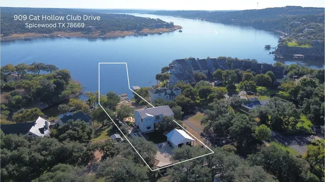 an aerial view of houses with yard