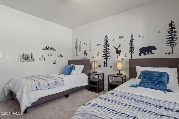 a bedroom with double bed and a couch