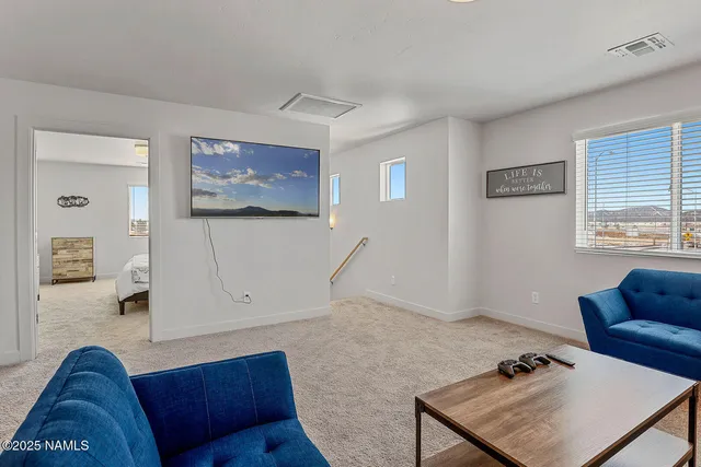 a view of livingroom with furniture and windows