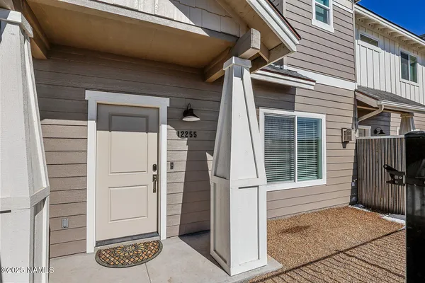 a view of a door and a window