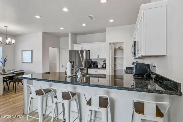 a kitchen with counter top space cabinets and stainless steel appliances
