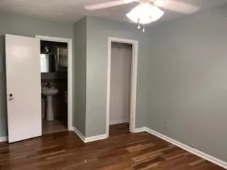 a view of a room with wooden floor