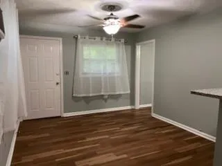 a view of an empty room with glass door