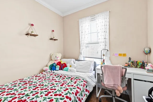 a bedroom with a bed and a table