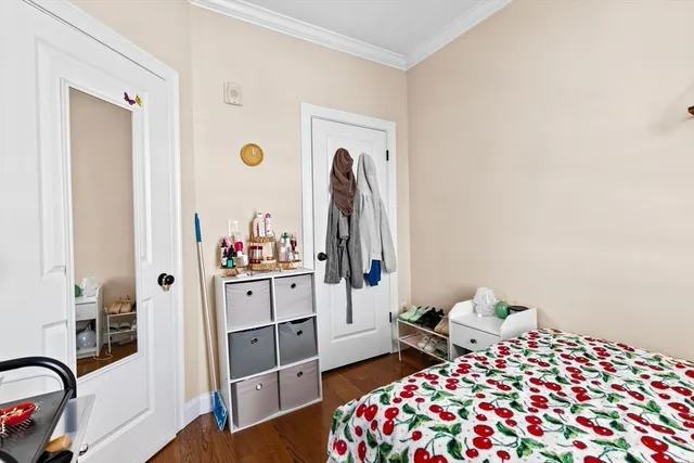 a bedroom with a bed and a dresser