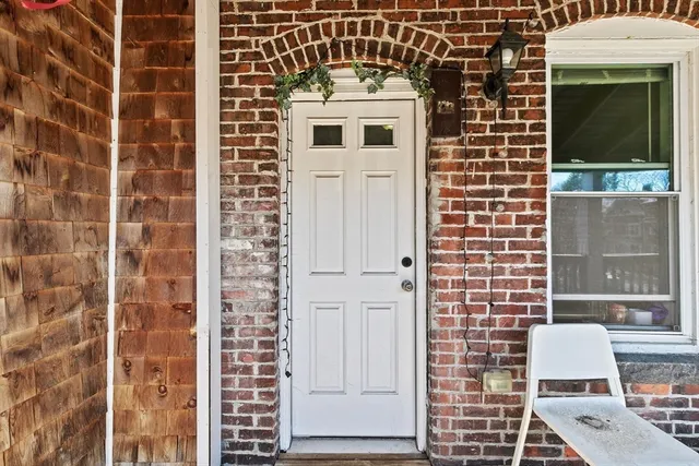 a view of a door and chair in the balcony