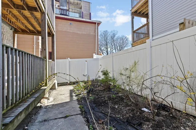 a view of a chair and table in the balcony