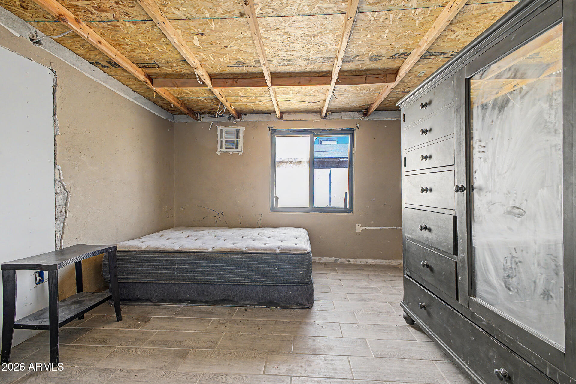1612 South 5th Street Phoenix, AZ 85004 - Photo 8 of 27 a spacious bedroom with a bed and a window
