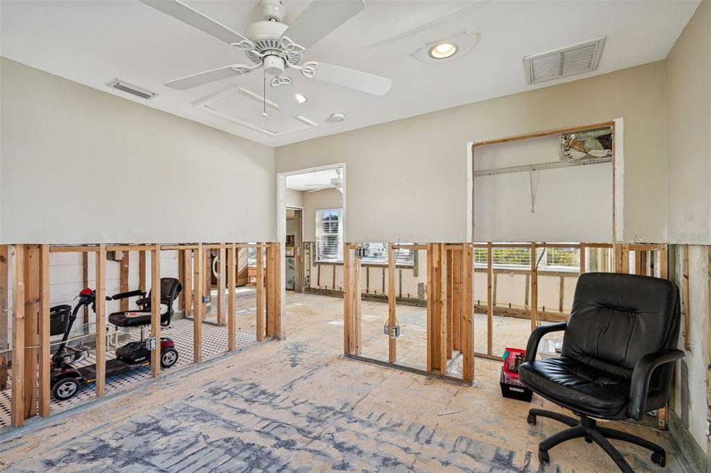 19 Sandpiper Road Tampa, FL 33609 - Photo 15 of 64 a view of a livingroom with workspace and a window