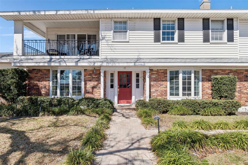 19 Sandpiper Road Tampa, FL 33609 - Photo 3 of 64 a front view of a house with a yard and outdoor seating