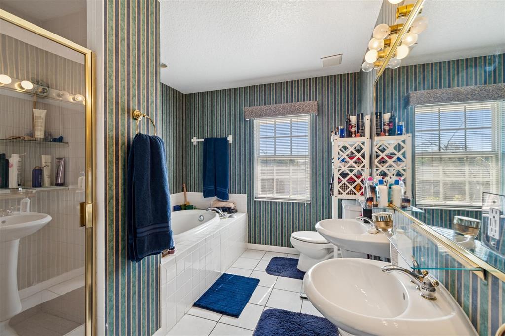 19 Sandpiper Road Tampa, FL 33609 - Photo 39 of 64 a bathroom with a sink toilet and shower