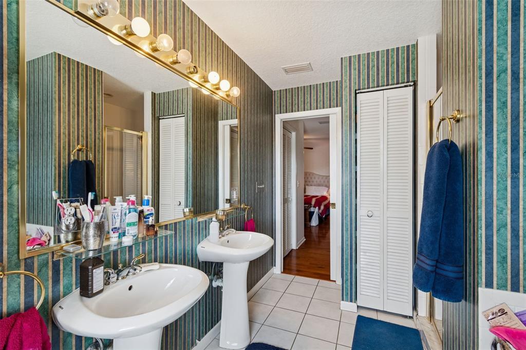19 Sandpiper Road Tampa, FL 33609 - Photo 40 of 64 a bathroom with a sink and a mirror