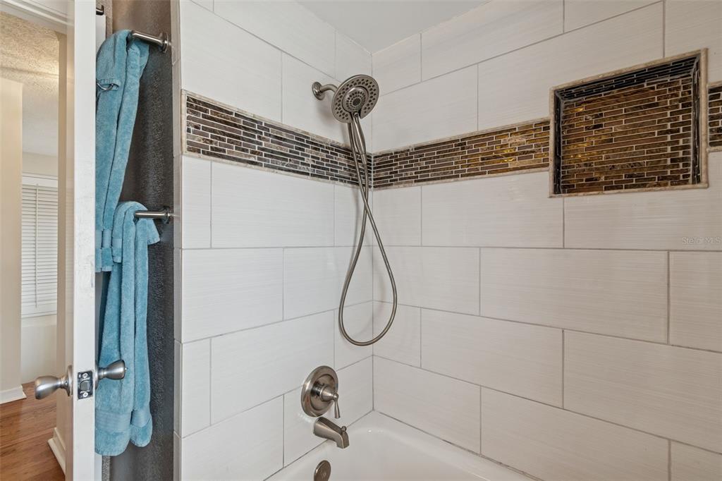 19 Sandpiper Road Tampa, FL 33609 - Photo 44 of 64 a bathroom with a shower