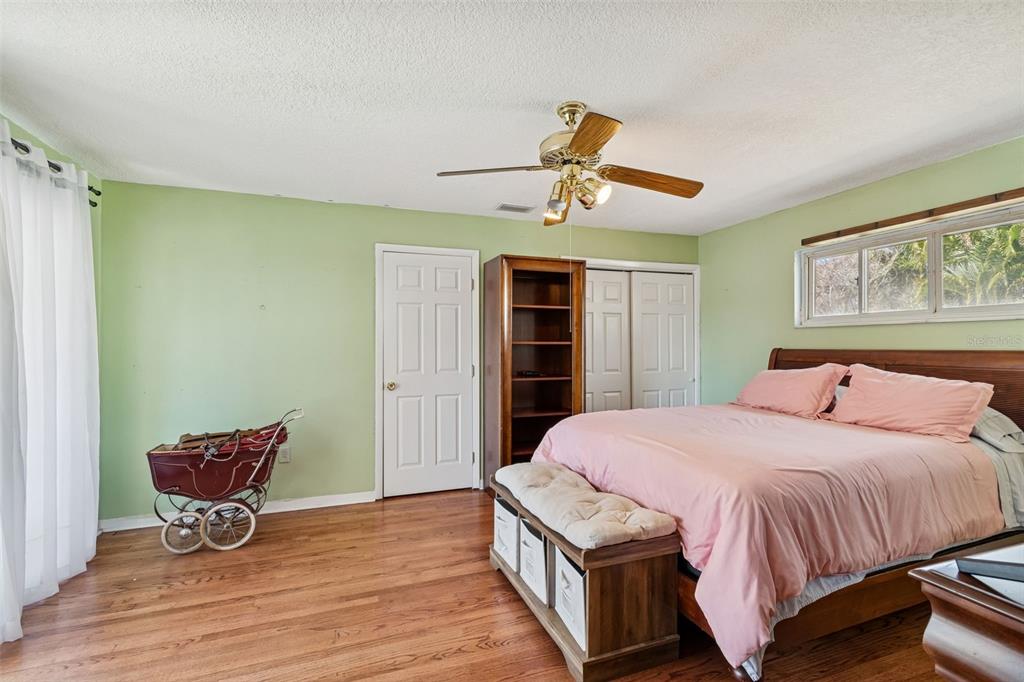 19 Sandpiper Road Tampa, FL 33609 - Photo 45 of 64 a bedroom with a bed and a chair