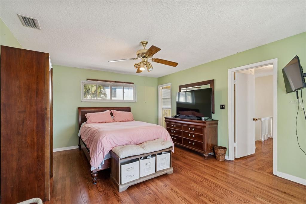 19 Sandpiper Road Tampa, FL 33609 - Photo 46 of 64 a bedroom with a bed and a flat screen tv