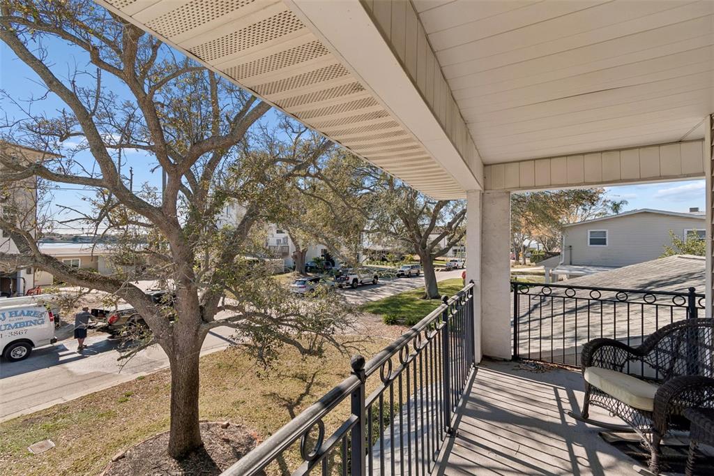 19 Sandpiper Road Tampa, FL 33609 - Photo 50 of 64 a view of a porch with furniture and trees