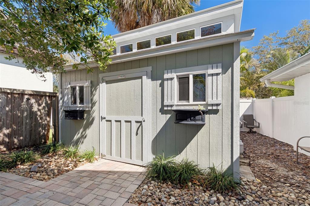 19 Sandpiper Road Tampa, FL 33609 - Photo 58 of 64 a front view of a house with a yard