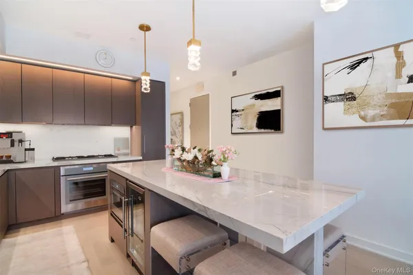 a kitchen with a stove a sink and a refrigerator