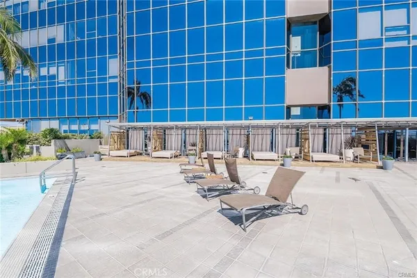 a view of a swimming pool with a lounge chair