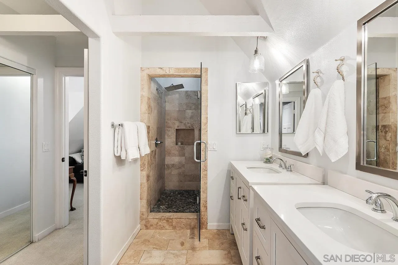 1258 Oak Avenue Carlsbad, CA 92008 - Photo 18 of 29 a bathroom with a granite countertop sink mirror and shower