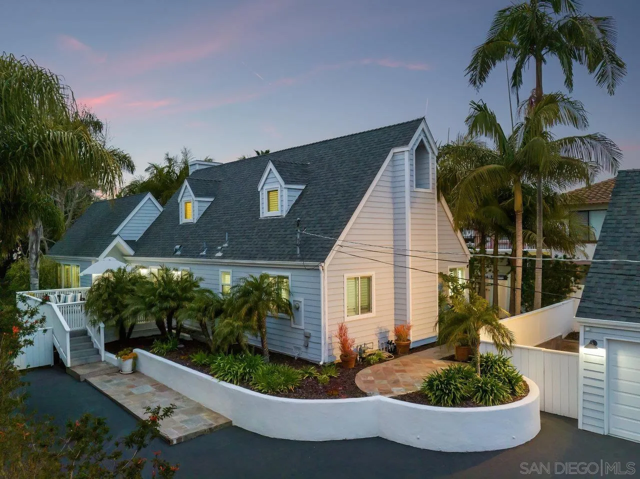 1258 Oak Avenue Carlsbad, CA 92008 - Photo 26 of 29 a front view of a house with a yard and potted plants
