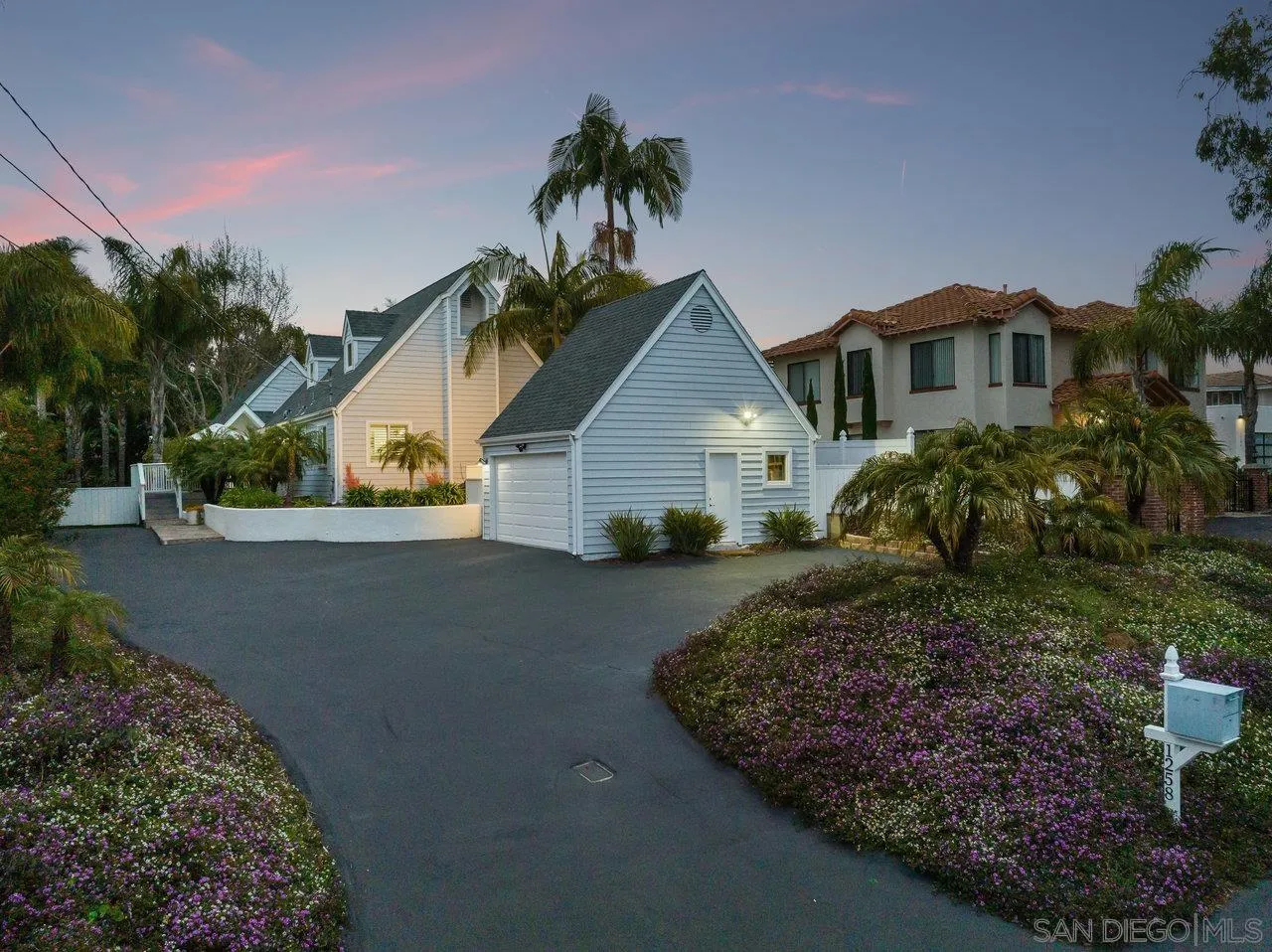 1258 Oak Avenue Carlsbad, CA 92008 - Photo 27 of 29 a front view of a house with a yard and garage