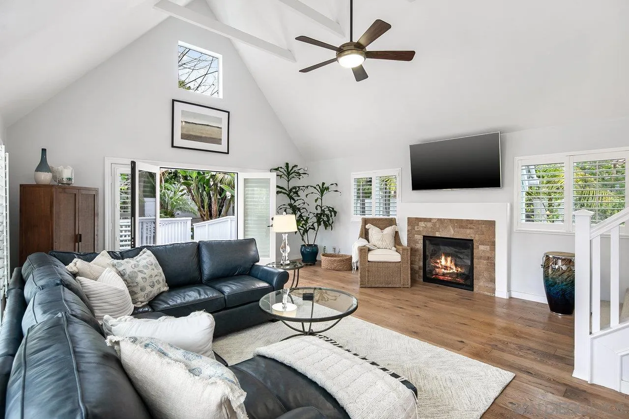 1258 Oak Avenue Carlsbad, CA 92008 - Photo 5 of 29 a living room with furniture a fireplace and a flat screen tv