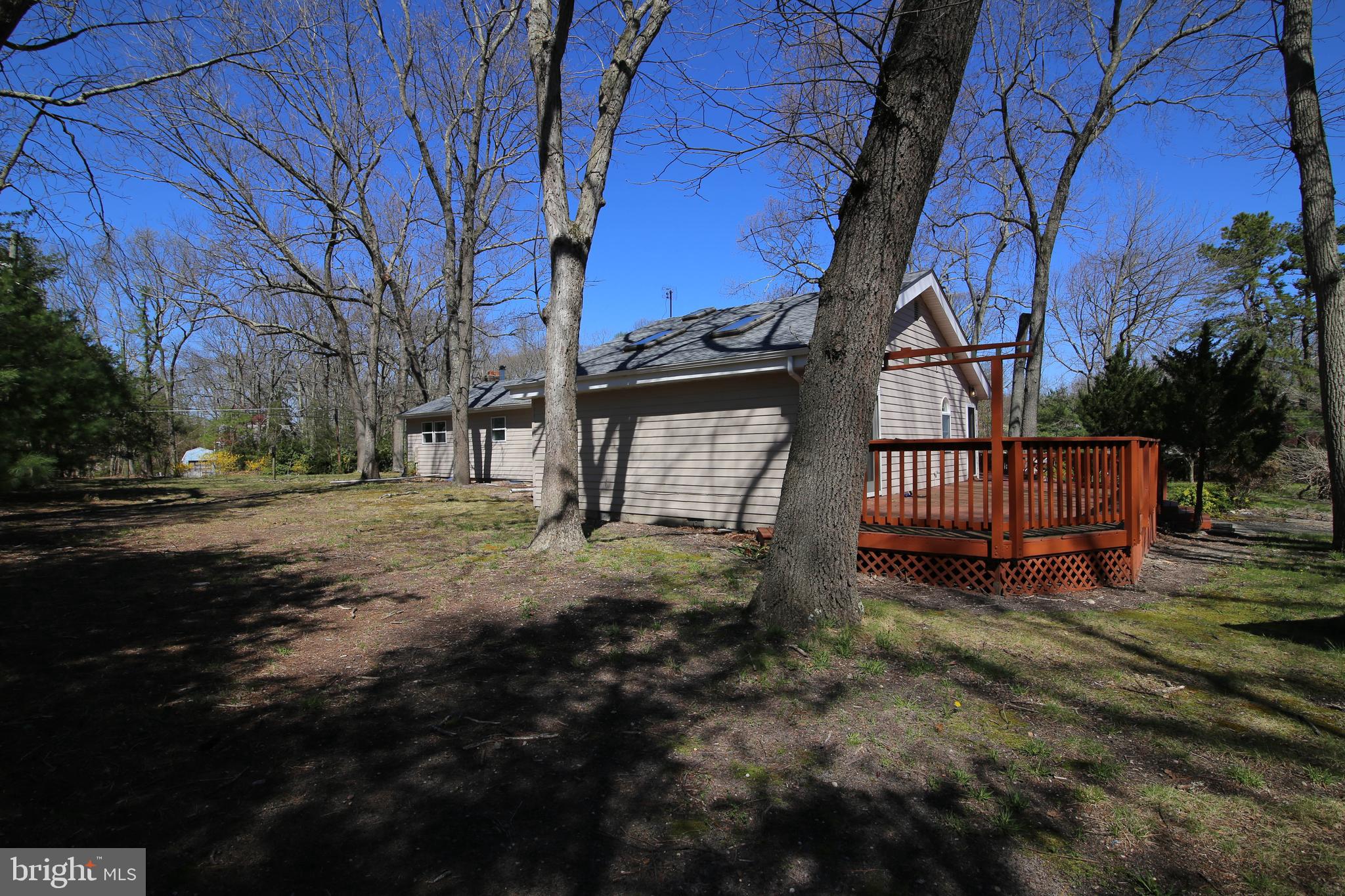 22 Richter Road Tabernacle, NJ 08088 - Photo 52 of 52 a view of backyard with wooden fence and large trees