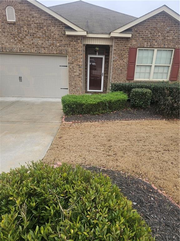 1738 Blue Heron Way Hampton, GA 30228 - Photo 13 of 36 a front view of a house with garden