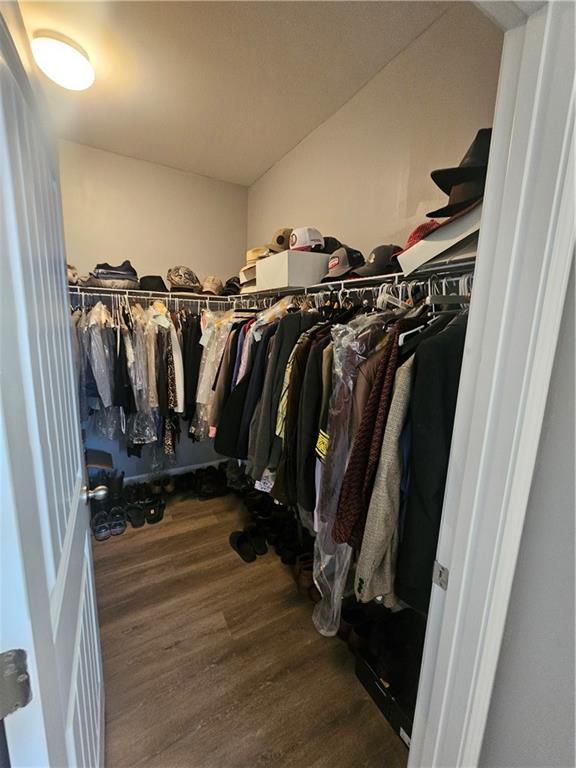 1738 Blue Heron Way Hampton, GA 30228 - Photo 24 of 36 a view of walk in closet with clothes and shoes
