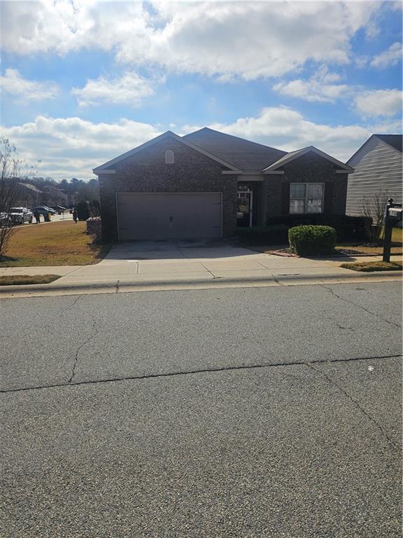 1738 Blue Heron Way Hampton, GA 30228 - Photo 33 of 36 front view of a house with a yard