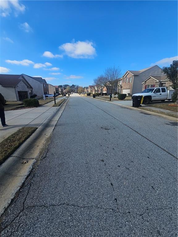 1738 Blue Heron Way Hampton, GA 30228 - Photo 36 of 36 a view of city street with a car parked on the road
