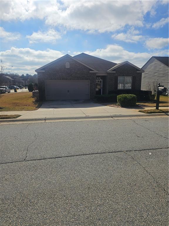 1738 Blue Heron Way Hampton, GA 30228 - Photo 4 of 36 front view of a house with a yard