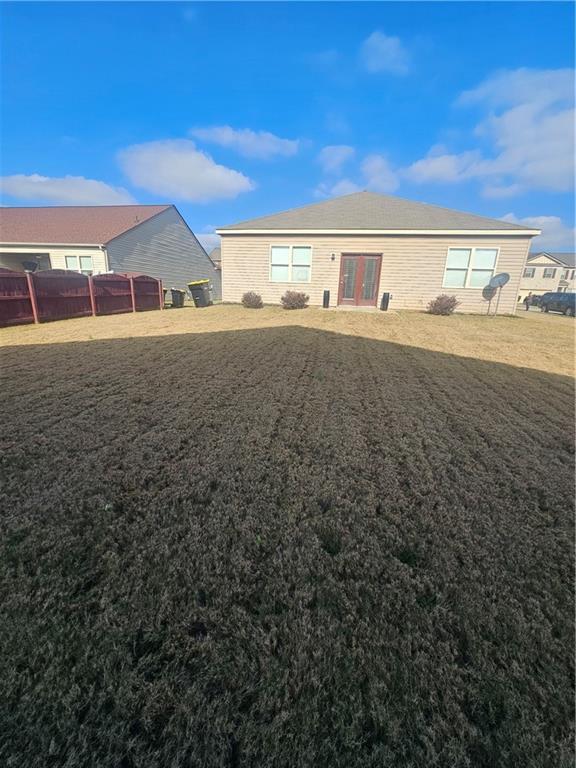 1738 Blue Heron Way Hampton, GA 30228 - Photo 8 of 36 a front view of a house with a yard