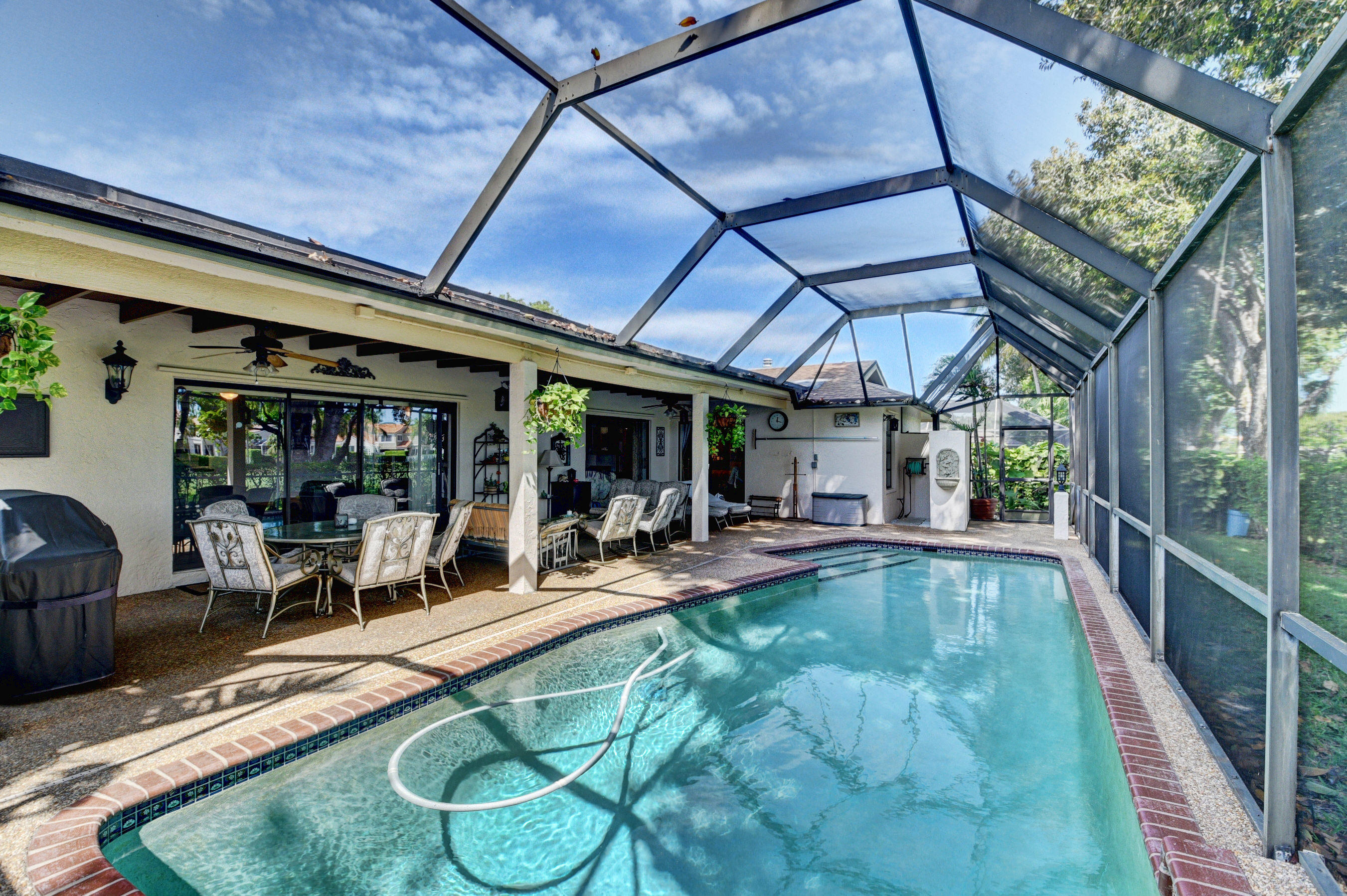 4045 Birchwood Drive Boca Raton, FL 33487 - Photo 33 of 54 Exterior Back & Screened Pool